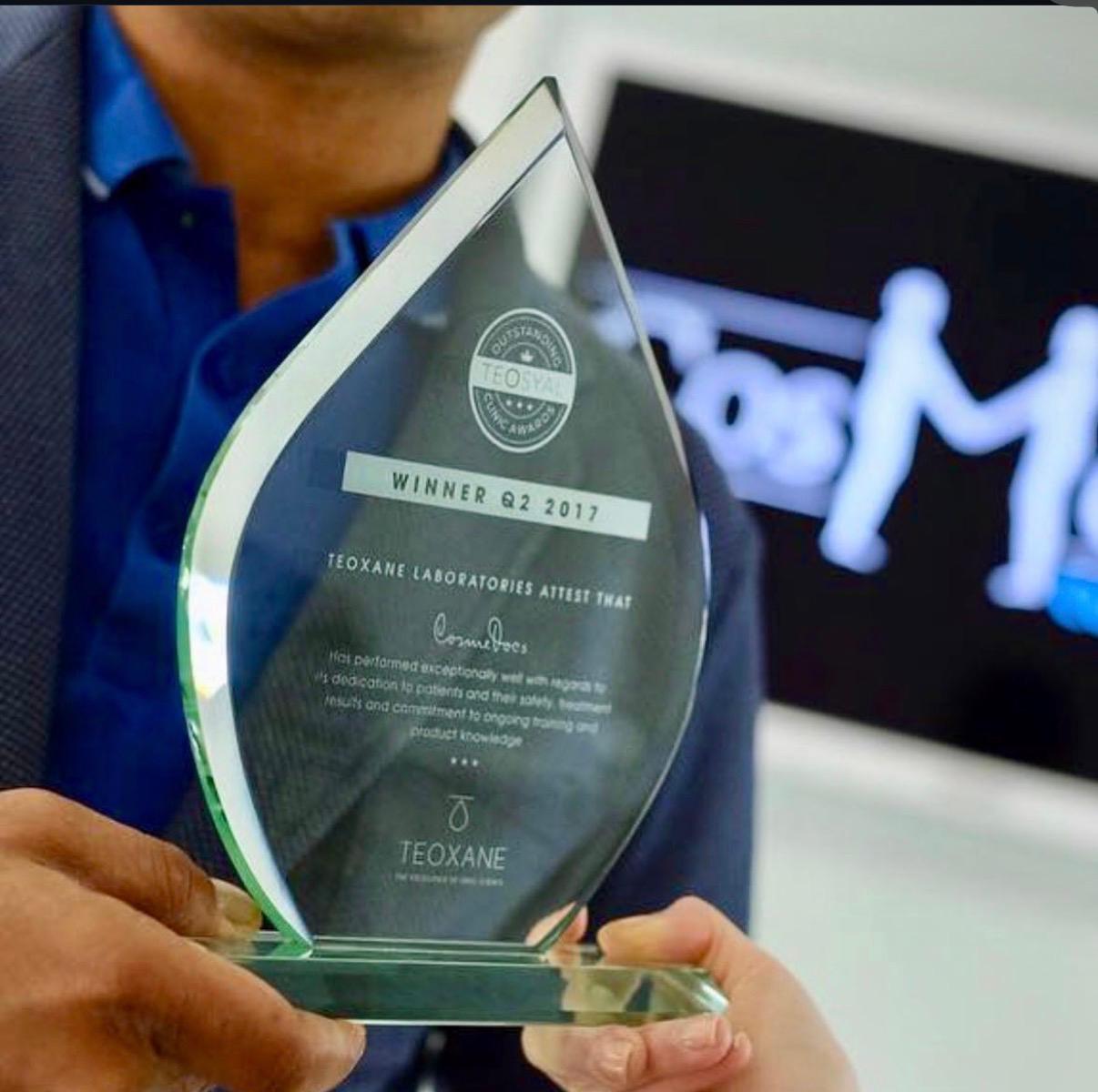 Dr. Ahmed Haq receiving Teoxane award for excellence in aesthetic medicine training