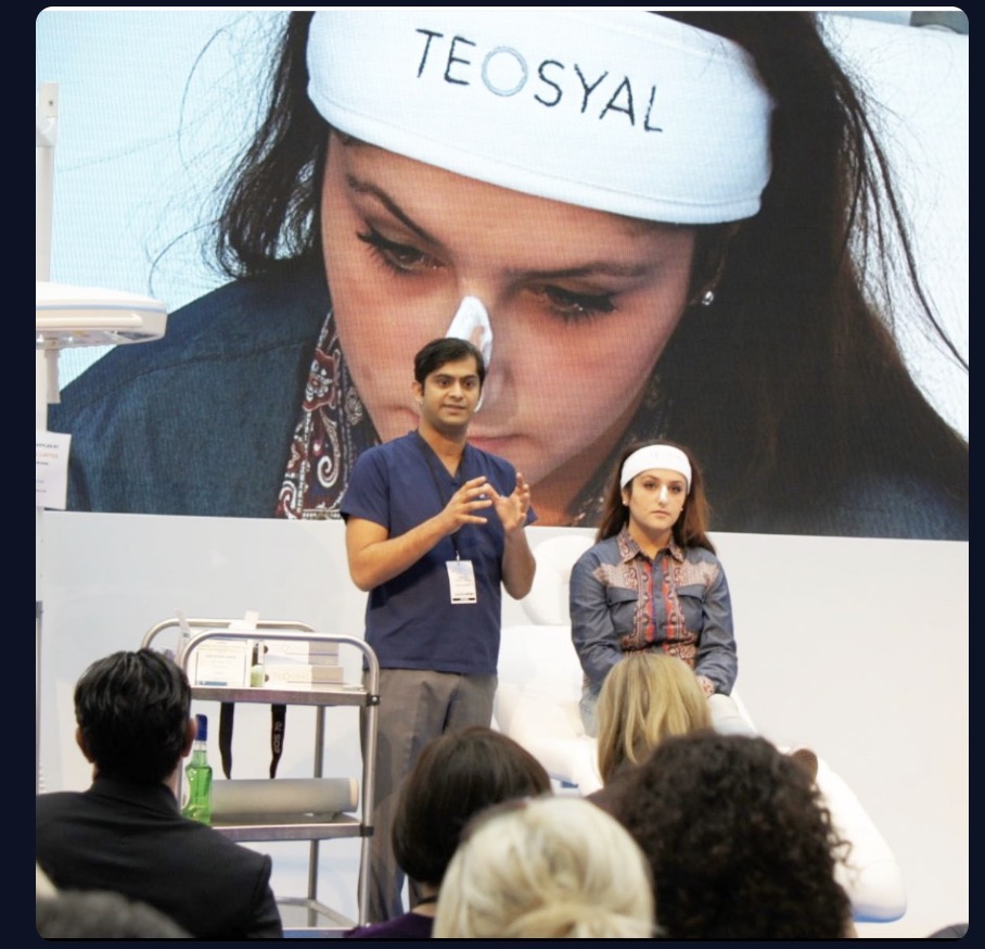 Dr. Haq demonstrating non-surgical rhinoplasty techniques at medical conference
