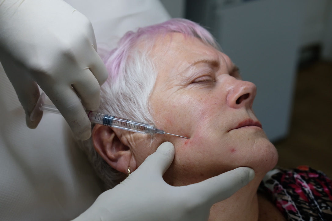 Advanced patient assessment showing comprehensive facial analysis and treatment planning